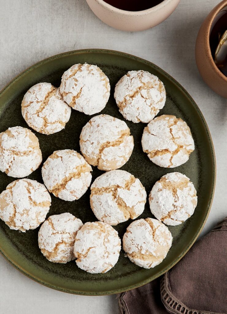 Almond cookies on plate with tea