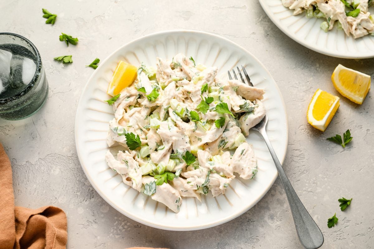 Chicken salad on a plate with fork.