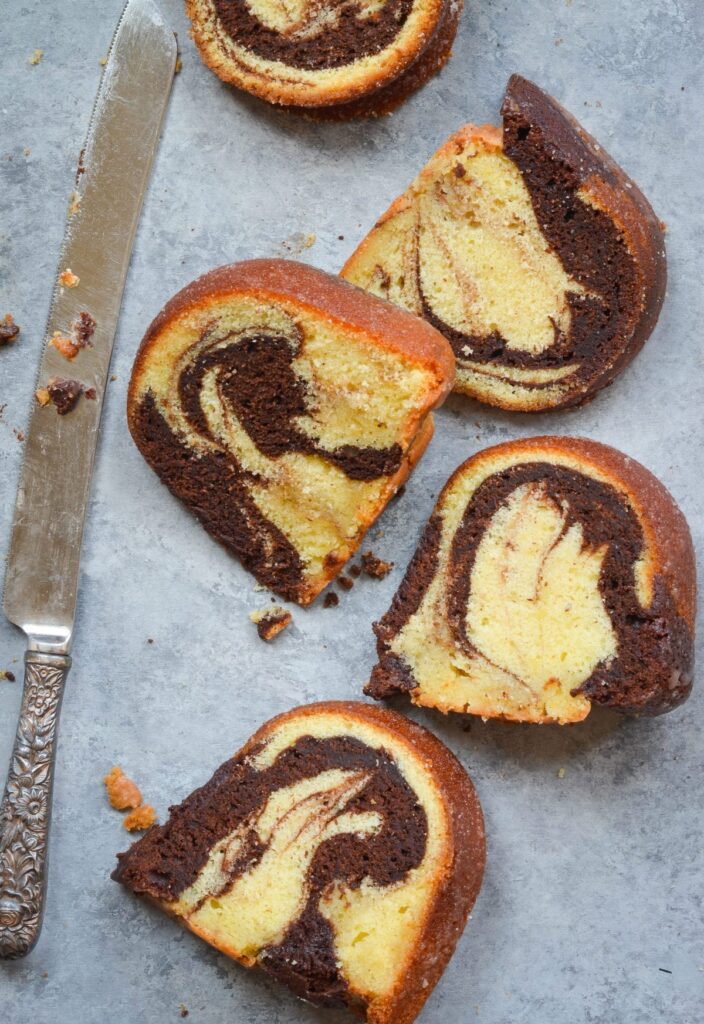Slices of marble cake with a butter knife.