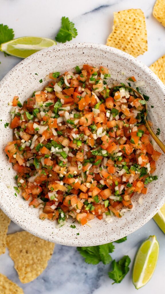 pico de gallo in white bowl with tortilla chips