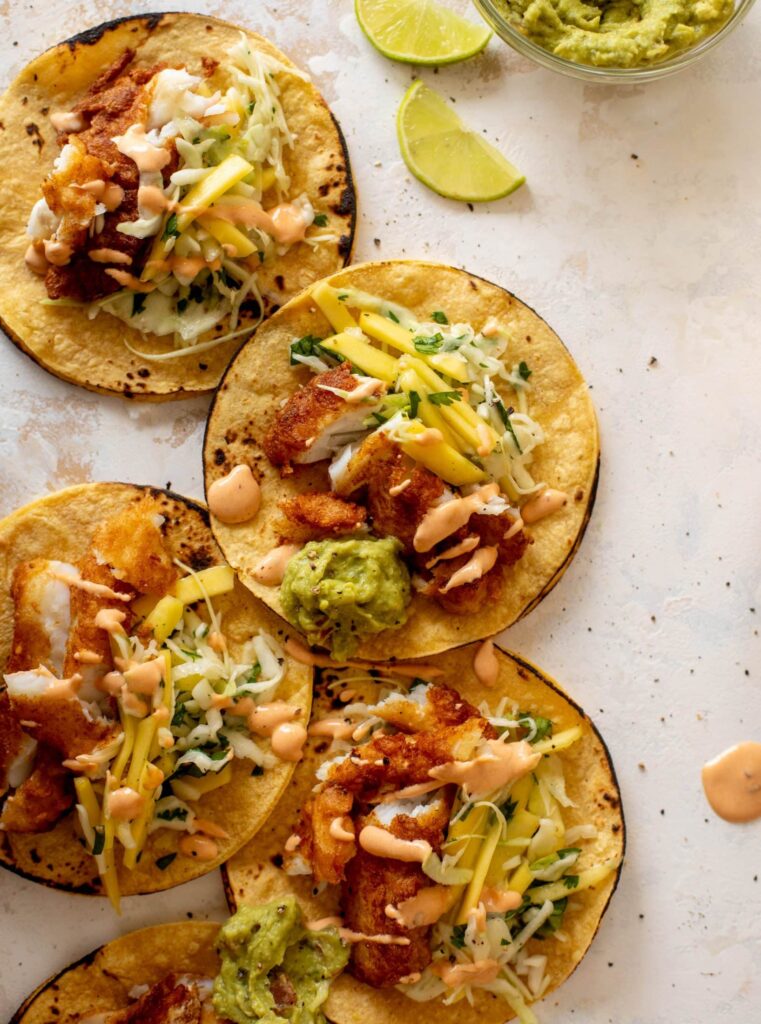 Beer Battered Fish Tacos with Mango Slaw and Chipotle Crema